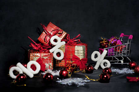 Black Friday abstract photo. Happy Merry Christmas. Shopping cart with decorative presents.の写真素材