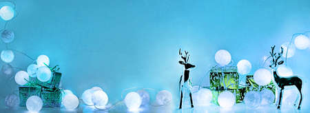 Christmas decorations. Round electric Christmas lights with some decor elements. Horizontal banner.の写真素材