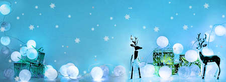 Christmas decorations. Round electric Christmas lights with some decor elements. Horizontal banner.