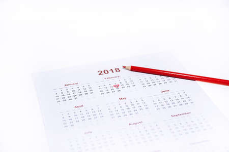 Valentine day abstract photo. Calendar with pencil isolated on white background.の写真素材