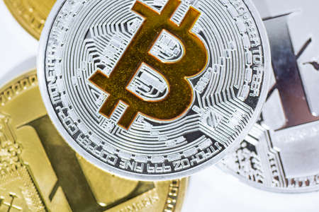 Abstract photo of cryptocyrrency. Some cryptocurrency coins in mans hand. Isolated on white background.の写真素材