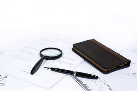 Abstract photo of documents. Documents on white table with some decorations. Office work. Business daily job.の写真素材