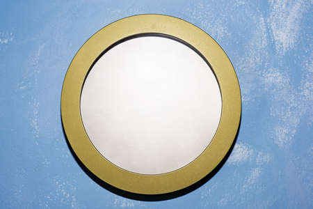 Empty plate or wall clock on blue background. Abstract photo.の写真素材