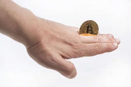 Abstract photo of cryptocyrrency. Some cryptocurrency coins in mans hand. Isolated on white...