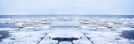 Ice drift on Baltic sea. Spring cloudy day. Abstract landscape photo.の写真素材