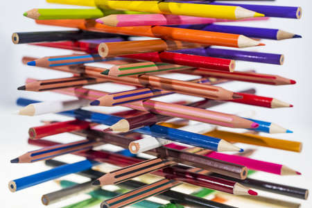 Colored pencils on table. Isolated on white background.の写真素材