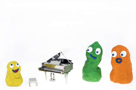Abstract photo of music. Small metal piano with notes book. Piano Jazz music.