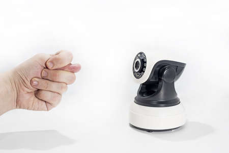 Spy video camera isolated on white background. Abstract surveillance idea through web camera.