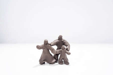 Happy family concept. Figures made from play clay. Family under the big glass dome.の写真素材