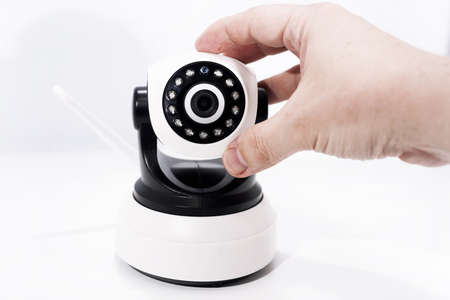 Spy video camera isolated on white background. Abstract surveillance idea through web camera.