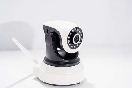 Spy video camera isolated on white background. Abstract surveillance idea through web camera.