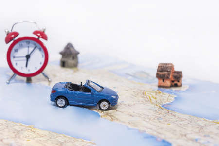 Abstract idea of rent a car. Small car on map. Abstract travel photo.