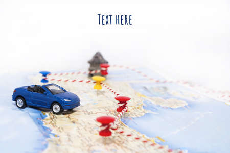 Abstract idea of rent a car. Small car on map. Abstract travel photo.