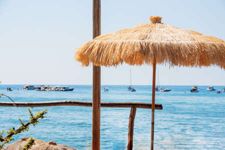 Relaxing atmosphere on tropical island. Summer vacation photo. Sunny day near ocean.の写真素材