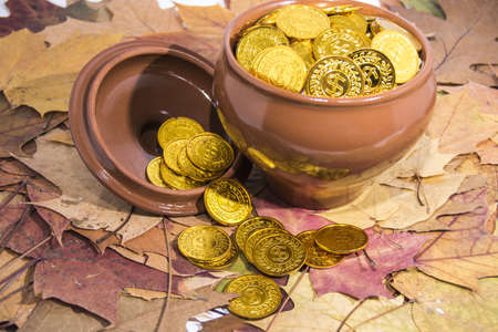 Isolated pot with golden coins. Abstract photo of lucky.の写真素材