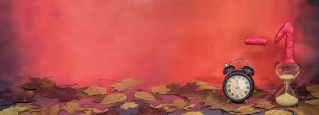 Daylight Saving Time. Wall Clock going to winter time. Autumn abstraction. Fall back time.の写真素材