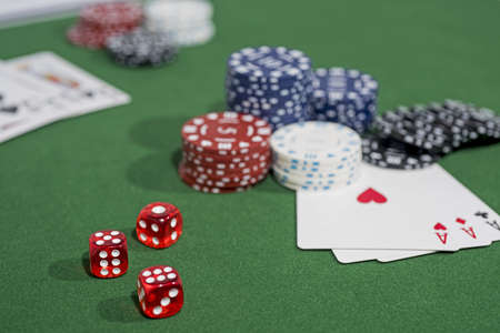 Casino abstract photo. Poker game on red background. Theme of gambling.