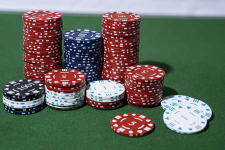 Casino abstract photo. Poker game on red background. Theme of gambling.