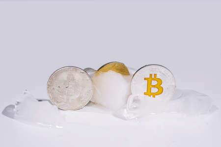 Frozen coins in ice.の写真素材