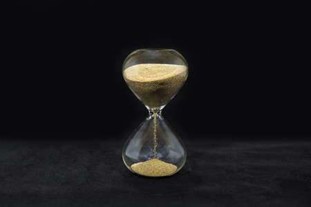 Time glass on blackの写真素材