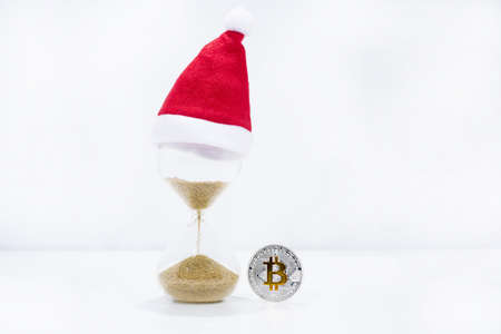 Abstract photo of cryptocyrrency. Some big crypto currency coins with sand clock.の写真素材