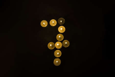 Numbers made from candles on blackの写真素材