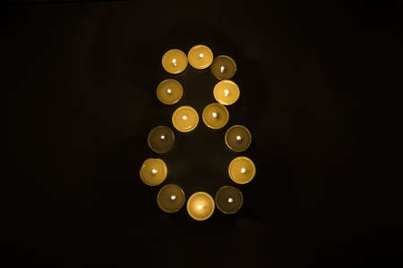 Numbers made from candles on blackの写真素材