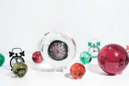 Time abstraction. Glass balls with clock reflections.の写真素材