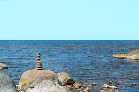 Stones balance on the beach. Place on Latvian coasts called Veczemju klintis