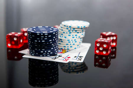 Casino abstract photo. Poker game on red background.  Theme of gambling.