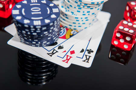 Casino abstract photo. Poker game on red background.  Theme of gambling.