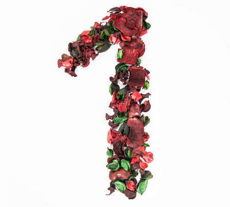 Latin alphabet letter made from dry rose flowers.