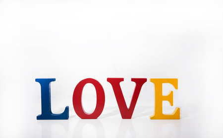 Love colored wooden letters on white background.の写真素材