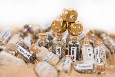 Glass test-tube with sand of different summer vacation countries.の写真素材