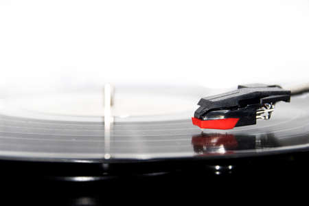Vinyl turntable on a white background. Retro audio equipment for vinyl disk.