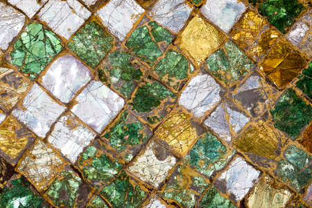 Colorful old stone mosaic on the wall.の写真素材