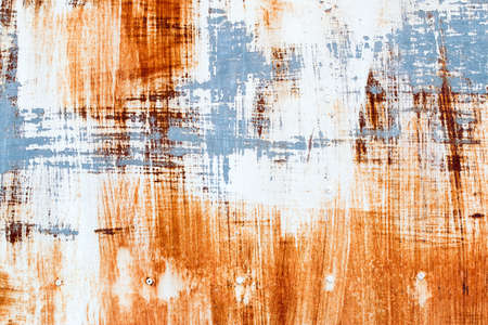A background of peeling paint and rusty old metalの写真素材