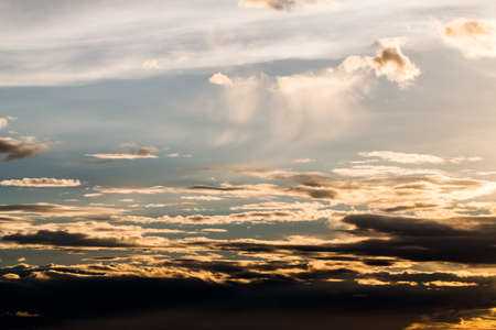 colorful dramatic sky with cloud at sunsetの写真素材