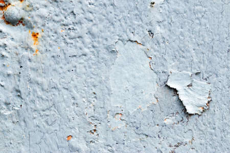 A background of peeling paint and rusty old metal