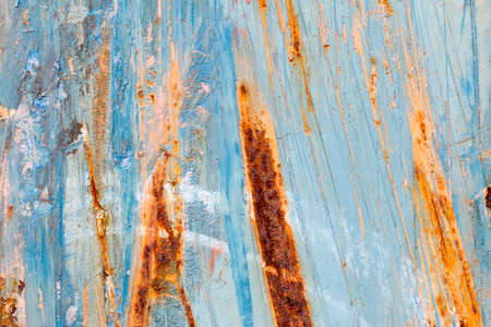 A background of peeling paint and rusty old metalの写真素材