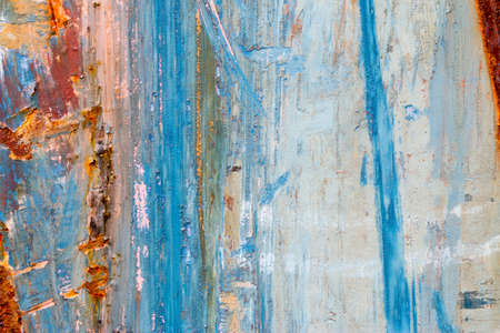A background of peeling paint and rusty old metalの写真素材
