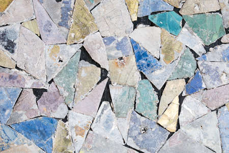 Colorful old stone mosaic on the wall.の写真素材