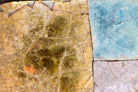 Colorful old stone mosaic on the wall.の写真素材