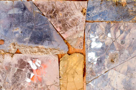 Colorful old stone mosaic on the wall.の写真素材