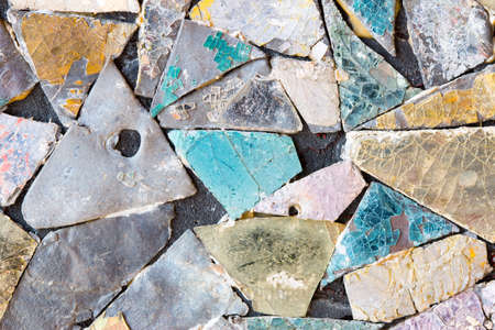 Colorful old stone mosaic on the wall.の写真素材