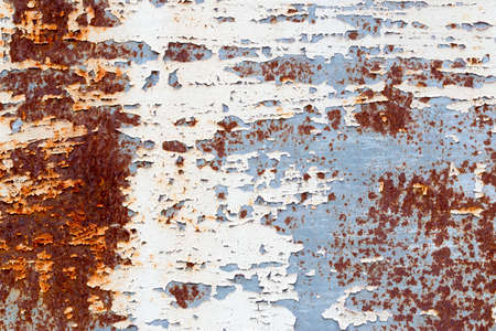 A background of peeling paint and rusty old metalの写真素材