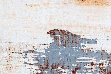 A background of peeling paint and rusty old metal
