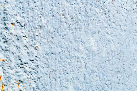 A background of peeling paint and rusty old metal