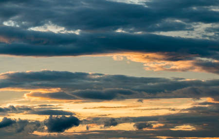 colorful dramatic sky with cloud at sunsetの写真素材