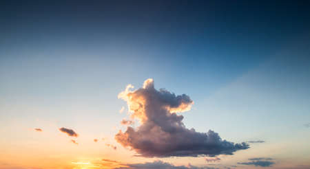 colorful dramatic sky with cloud at sunsetの写真素材